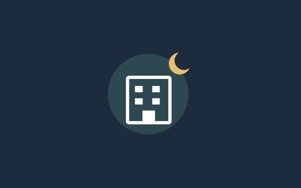 A cream hotel symbol and crescent moon on a navy background, illustrating late hotel arrival.